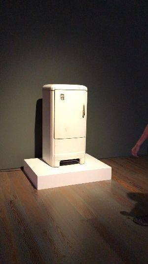 Ed Horsford walks up to an old white fridge. As he opens it a loud air-raid siren is emitted. He laughs and shuts the fridge.